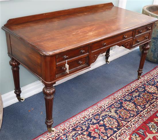 A Heals writing table W.138cm